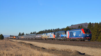 First run: Amtrak no. 8, the eastbound Empire Builder, overtakes a BNSF empty grain train at Moab, Wash. Bruce Kelly photo