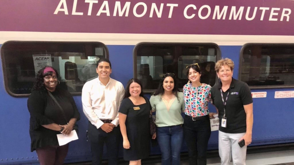 The San Joaquin Regional Rail Commission’s (SJRRC) ACE Rail Maintenance Facility will house the future Rail Academy of Central California (TRACC), which is seeking 70 students for instruction and hands-on-training this fall. Pictured: SJRRC TRACC Lead Tamika Smith (far left); San Joaquin Council of Governments Executive Director Diane Nguyen (third from left); and SJRRC Executive Director Stacey Mortensen (far right).