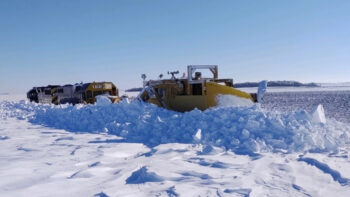 Red River Valley & Western Jordan Spreader in action near Gwinner, N.Dak. (RRVW photo by David Badgley)