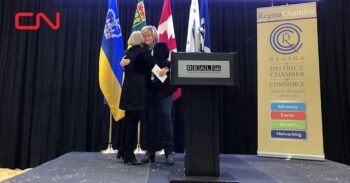 CN President and CEO Tracy Robinson (right) presents STARS President and CEO Andrea Robertson (left) with a $100,000 donation for the non-profit.