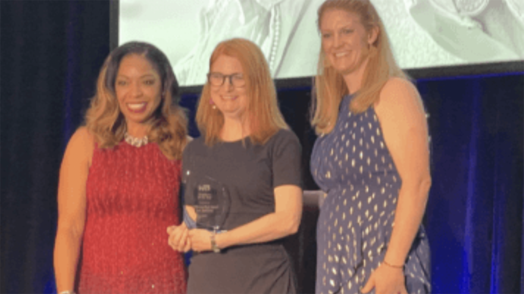 CHSRA Deputy Director Beverly Kenworthy (center) accepts the Employer of the Year award from WTS International. (Photograph Courtesy of CHSRA)