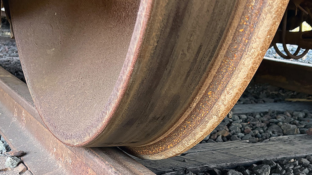 Figure 2: Photograph of a steel railway wheel in contact with a steel rail. (Courtesy of Gary T. Fry.)