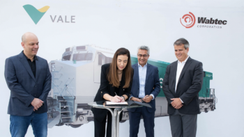 Ludmila Nascimento, Energy Director, Vale, signs agreement beside Marco Braga, Global Procurement Director, Vale (at left); Danilo Miyasato, President of Wabtec for Latin America; and Rogério Mendonça, President Freight Equipment Global, Wabtec (Caption Courtesy of Vale. Photo Credit: Fernanda Divardim)