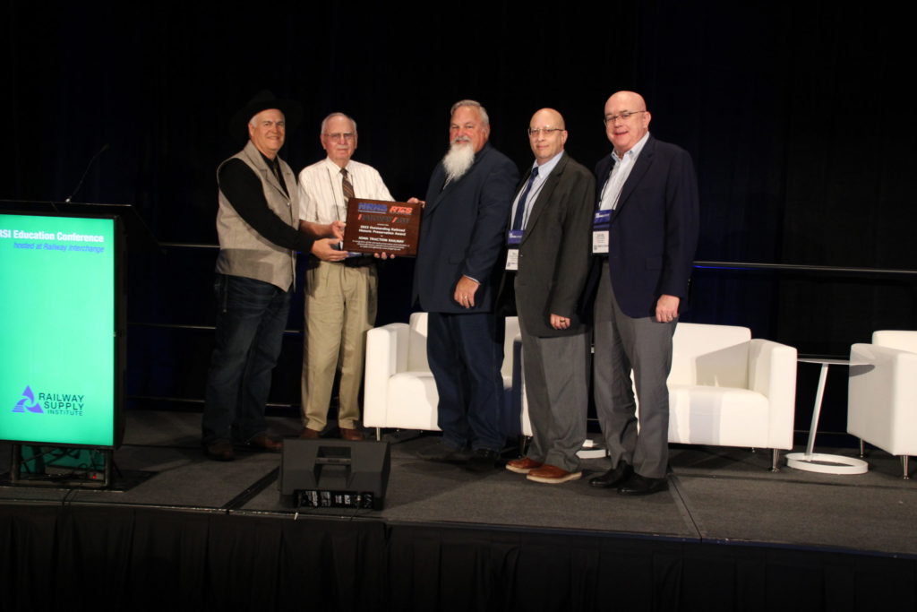 Left to right: Iowa Traction Railway Roadmaster Mike Rumeliote, former Iowa Traction Railway owner Dave Johnson, National Railway Historical Society representative Mike Yuhas, Railway Age Editor-in-Chief William C. Vantuono, Railway Track & Structures Editor-in-Chief David C. Lester.