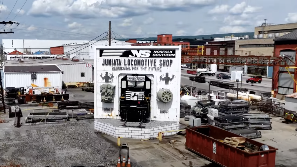 The team at Juniata Locomotive Paint Shop in Altoona, Pa., “creates the face of the Norfolk Southern”—from its Heritage units to the new Thoroughbred Locomotive and everything in between. (Screenshot of NS Video showcasing Juniata).