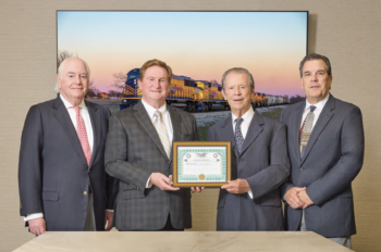 Tarantula Corporation said its TEXC acquisition was made possible due to the efforts of Bill Wood, Director of Contracts (pictured far right); Robert Ginsburg, Director, McDonald Sanders, P. C. (far left); and Kevin Sheys of Rail Regulatory Law, who helped secured the Surface Transportation Board exemption. Also pictured (left to right, after Sanders): Kevin Erasmus, President and CEO of Davoil, Inc. and Fort Worth & Western Railroad Company, and William Davis Sr., Chairman of the Board. (Tarantula Corporation Photograph)