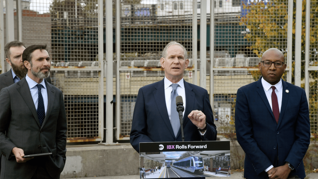 New York MTA Chair and CEO Janno Lieber, MTA Construction and Development President Jamie Torres-Springer, and Queens Borough President Donovan Richards on Oct. 29 announced an RFP for the design phase of the proposed Interborough Express (IBX) near the future site of the Jackson Heights terminal at 71st St. (Marc A. Hermann / MTA)