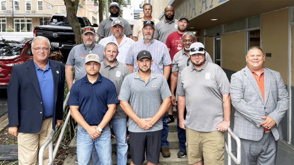 BLET Vice President Randy Fannon (far left) and BLET Special Representative Jorge Gomez (far right) with newly organized members from Florida Gulf & Atlantic in 2023. (Caption and Photograph Courtesy of BLET)