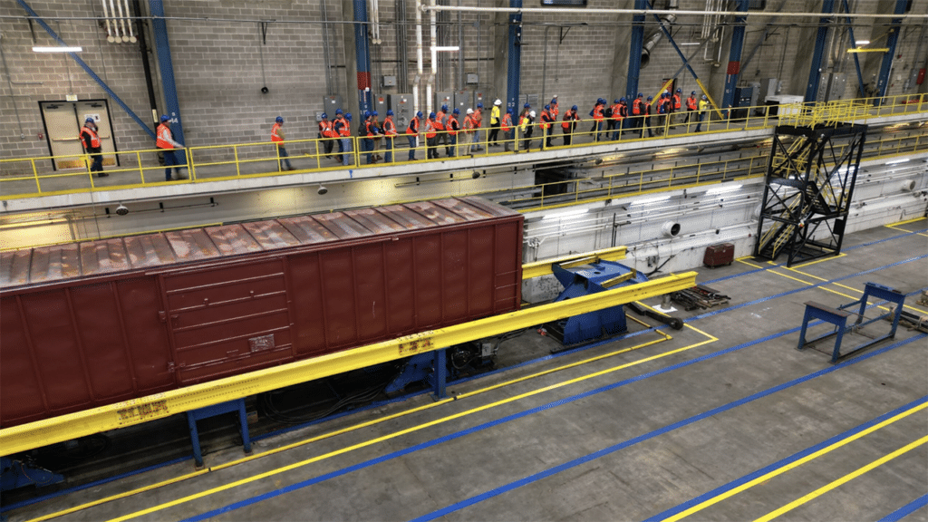 Overview of the refreshed Simuloader (SMU) being showcased to a breakout tour group during the 2024 TTC Conference & Tour. (TTC Operated by ENSCO Photograph)