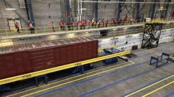 Overview of the refreshed Simuloader (SMU) being showcased to a breakout tour group during the 2024 TTC Conference & Tour. (TTC Operated by ENSCO Photograph)
