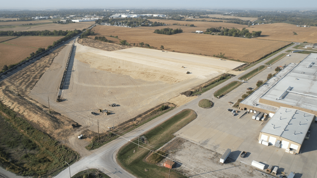 This drone image shows the site of Iowa Interstate Railroad's wind energy component transload facility in Newton, Iowa, while it was under construction. Directly adjacent to the facility is TPI Composites, a wind turbine blade manufacturer. (Caption and Photograph Courtesy of ASLRRA)