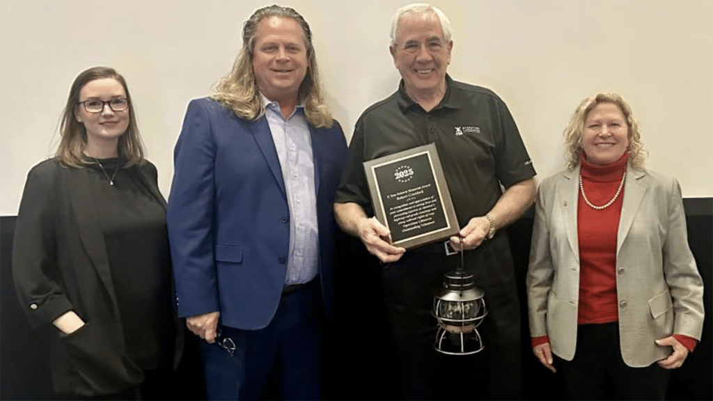 OLI Board Chair and ASLRRA SVP, Safety, Regulatory, and Environmental Policy Jo Strang (far right) pictured with F. Tom Roberts Memorial Volunteer Award honoree Bob Crawford (center). They are joined by Jessica Devorsky, Texas Operation Lifesaver State Coordinator and F. Tom Roberts Award Committee Chair (far left), and Mark Sexton, Oklahoma Operation Lifesaver State Coordinator. (OLI Photograph)