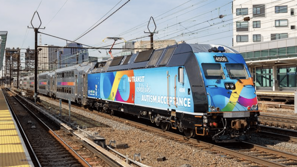 NJT rolled out specially wrapped vehicles, including a locomotive (pictured), for Autism Acceptance Month. (NJT Photograph)