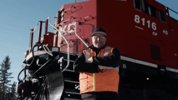Darryl Perry, a CPKC locomotive engineer in Sparwood, B.C., Canada, is one of the 200-plus “CPKC Hypermilers” who the railroad said “use their ‘feel’ for a locomotive and in-depth local knowledge, coupled with fuel-efficient strategies, to operate trains safely while reducing excess fuel burn.” (Screen Grab from CPKC Video)