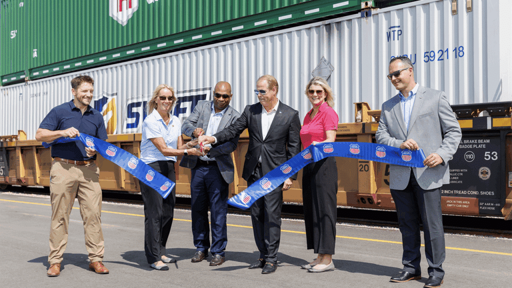 UP officially cut the ribbon for its new Kansas City Intermodal Terminal. From left, UP’s Ryan Steinbach, Assistant Vice President-Premium; Kari Kirchhoefer, Senior Vice President-Marketing and Sales; Kenny Rocker, Executive Vice President-Marketing and Sales; Hunsdon Cary, Vice President-Premium; Laura Heisterkamp, Assistant Vice President-Premium; and Zach Russell, General Manager-Premium. (UP Photograph)