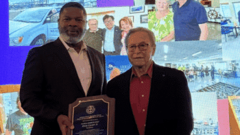 Pacific Harbor Line and President Otis L. Cliatt II (left) received the 2025 Maritime Industry Salute Award on Oct. 2. It was presented by Guy Fox, Chairman of the Board of the International Seafarers Center of the Ports of Long Beach and Los Angeles (right). (Photograph Courtesy of PHL)