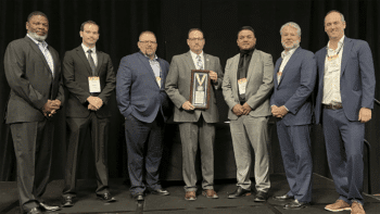 At ASLRRA’s recent Central and Pacific Region Meeting, which included more than 300 attendees, ASLRRA Executive Board Members Otis L. Cliatt II (pictured, left; VP, Pacific Region) and Matthew O. Walsh (second from right; Chair) and ASLRRA President Chuck Baker (right) presented the Belt Railway Company of Chicago with the President’s Award in the “More than 500,000 Person-Hours Worked” category. Accepting the safety award were Junior Software Developer Mason Myre, Assistant Chief Mechanical Officer Robert Perham, Superintendent Jason Charbonneau and Manager of Signals Jorge Guerrero (second through fifth from left, respectively). (Photograph Courtesy of ASLRRA)