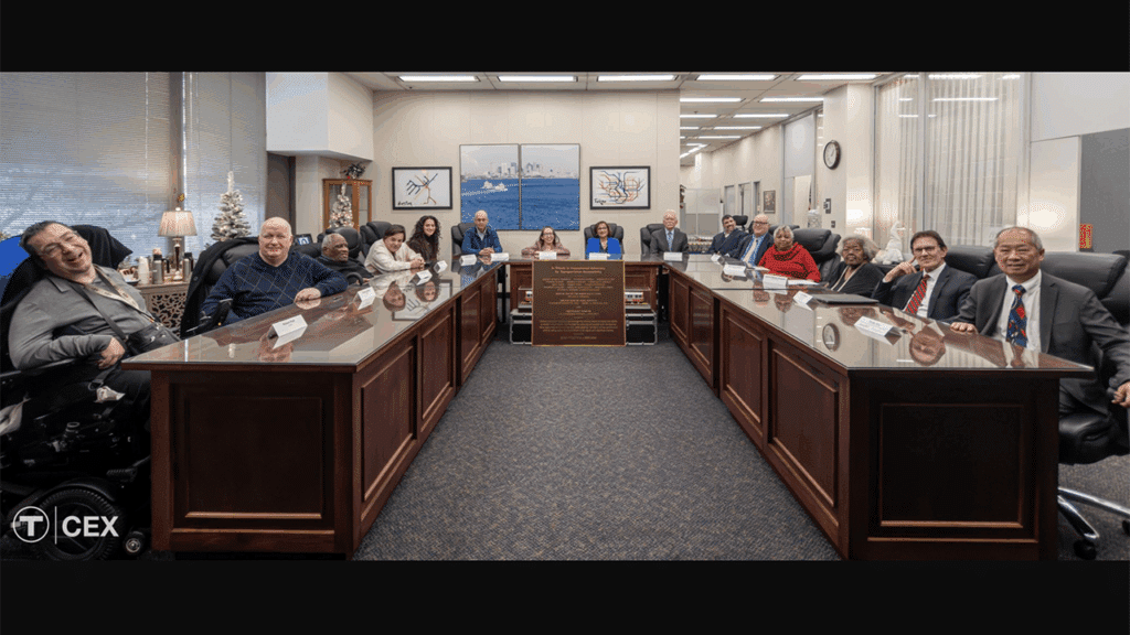 Pictured, Left to Right: Robert Park, Thomas Gilbert, Reginald Clark, Andrew Forman, Majda Abbas (Greater Boston Legal Services/GBLS), Bill Henning (Boston Center for Independent Living/BCIL), Laura Brelsford (MBTA), Taramattie Doucette (GBLS), Independent Monitor Judge Patrick King, Chris Hart (MBTA), Mark Katzoff (GBLS), Myrnairis (Mic) Cepeda, Joanne Daniels-Finegold, John Martin (MBTA), and Interim MassDOT Secretary and MBTA General Manager Phillip Eng. (Courtesy of MBTA)